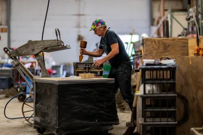 Arthur Conradi makes a pour mold at Port Townsend Foundry in Port Townsend, Washington on July 24, 2023. The PT Foundry uses sustainable techniques and ethically sourced metals to forge fittings for maritime use and has been in business since 1983.